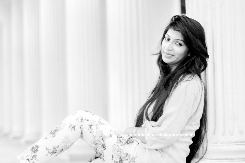 girl sitting image for outdoor shoot, black and white high key fashion portrait