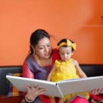 Mom & girl both watching Annaprasan or first Rice Ceremony Photo book Album