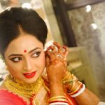 bengali bride getting ready for bridal photoshoot before wedding ceremony