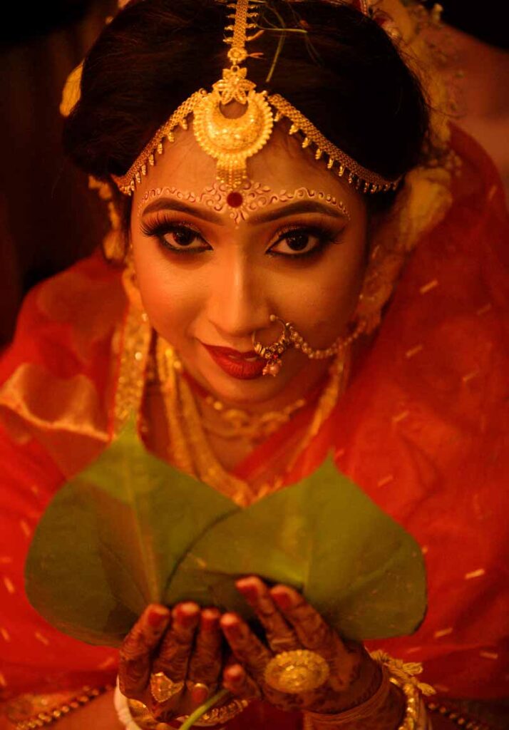 Bengali bride with paan pata Before Mala bodol of bengali bride with paan pata